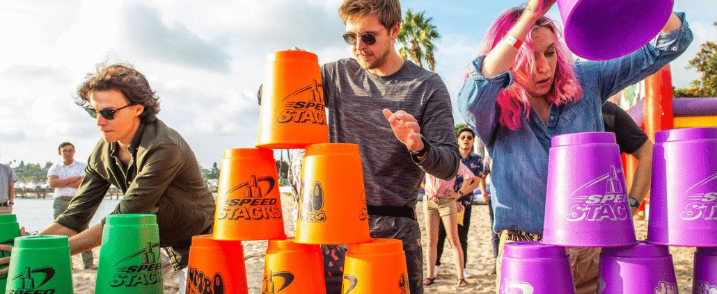 Woman Playing Wet Sponge Relay: Relay Race Ideas for Team Building