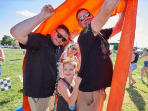 Team Playing Human Sprocket Field Game at Sheriff's Association Company Picnic